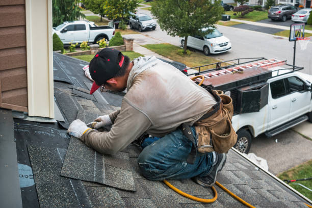 Professional Emergency Roof Repair technician working in Albia, IA